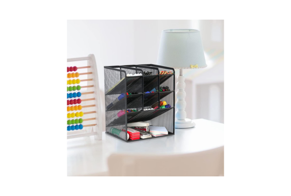 Meta Furniture black mesh Pen Holder with multiple compartments organizing pens and markers on a white desk