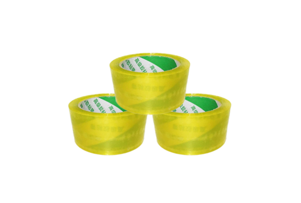 Three rolls of yellow Packing Tape stacked in a pyramid shape by Meta Furniture