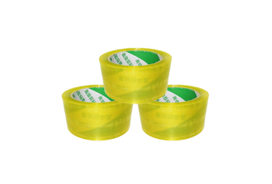 Three rolls of yellow Packing Tape stacked in a pyramid shape by Meta Furniture