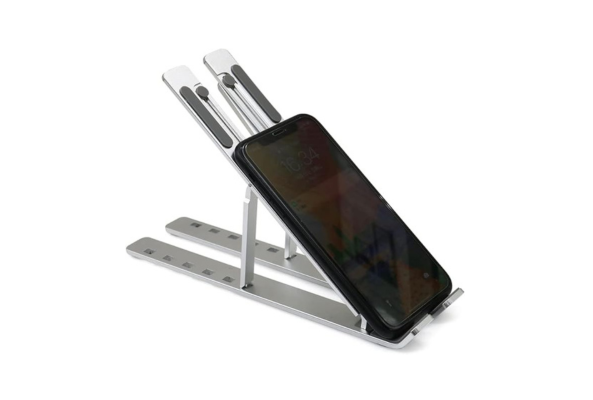 Silver metal adjustable Ipad Stand holding a black smartphone at an angled position